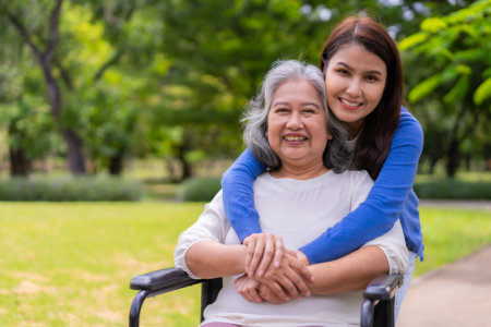caregiver hugging elderly woman